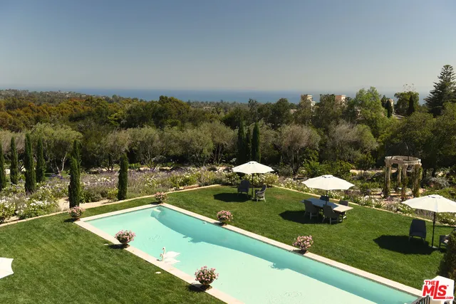 a view of a swimming pool with a patio