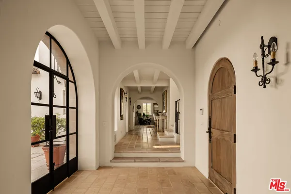 a view of a hallway view with staircase