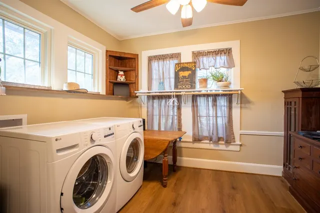 a view of entryway with window and wooden floor