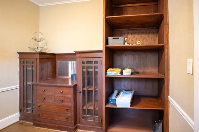 a kitchen with granite countertop a sink cabinets and stainless steel appliances
