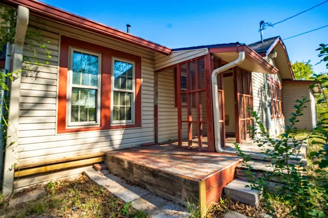 a view of balcony with chairs and a potted plant