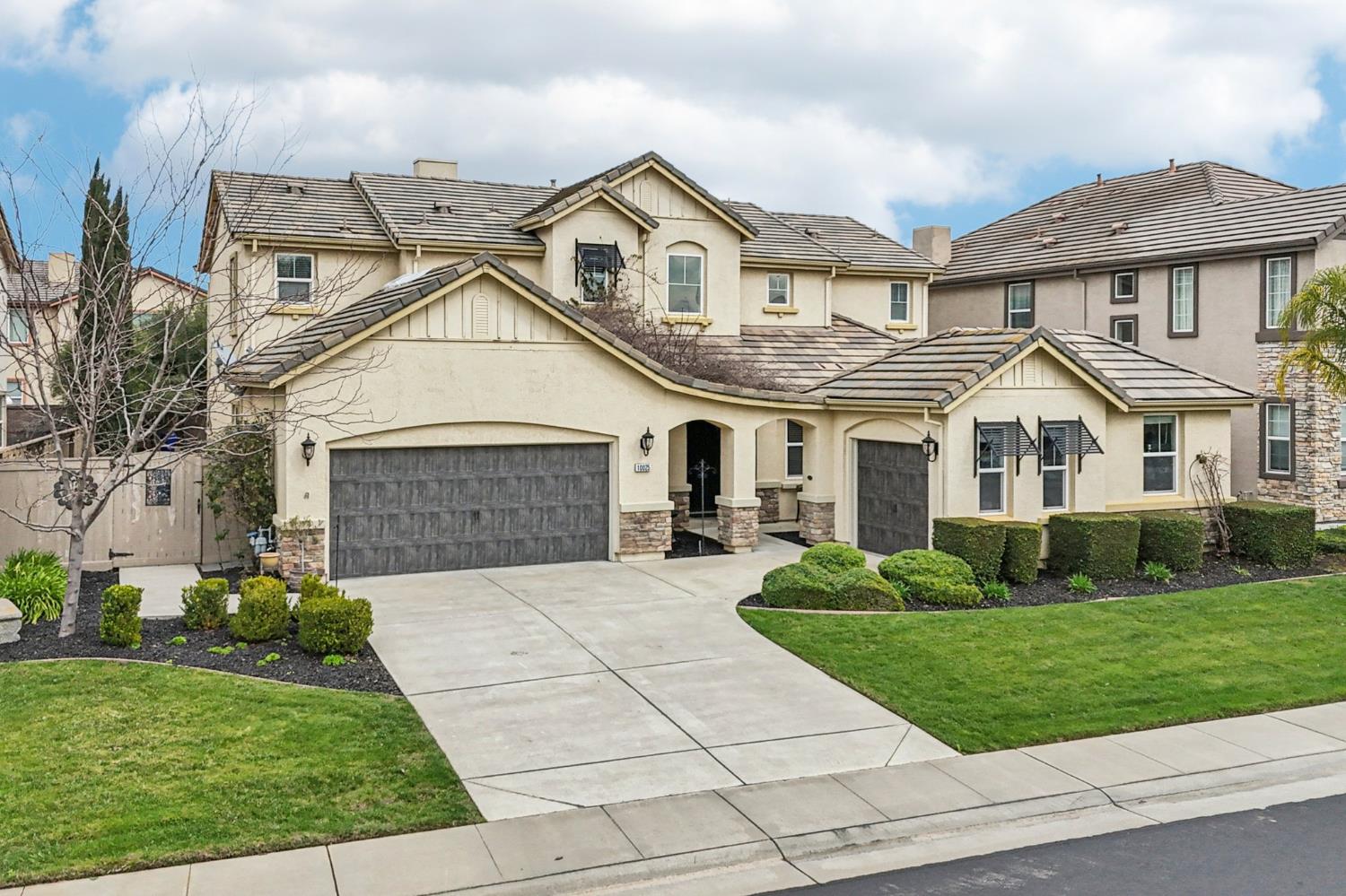 10025 Winkle Circle Elk Grove, CA 95757 - Photo 1 of 1 a front view of a house with a yard
