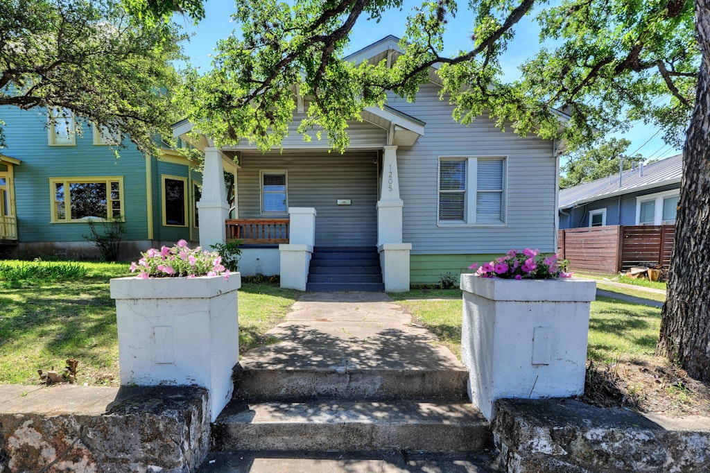 1205 East 12th Street Austin, TX 78702 - Photo 1 of 15 a view of a house with backyard and sitting area