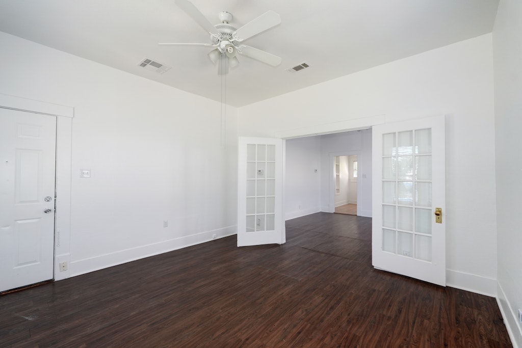 1205 East 12th Street Austin, TX 78702 - Photo 2 of 15 a view of an empty room with wooden floor