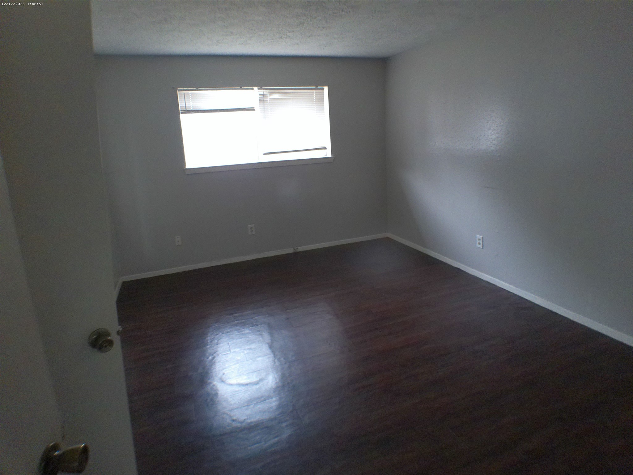 7322 West Fuqua Street Houston, TX 77489 - Photo 15 of 18 an empty room with wooden floor and windows
