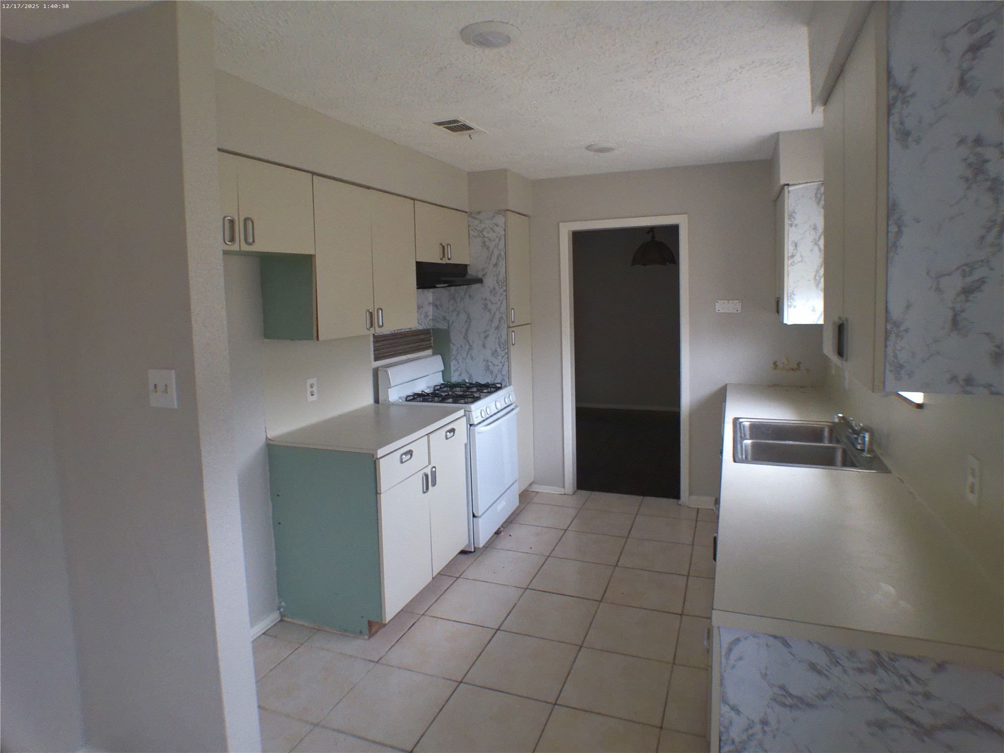7322 West Fuqua Street Houston, TX 77489 - Photo 8 of 18 a large white kitchen with a sink a refrigerator and cabinets