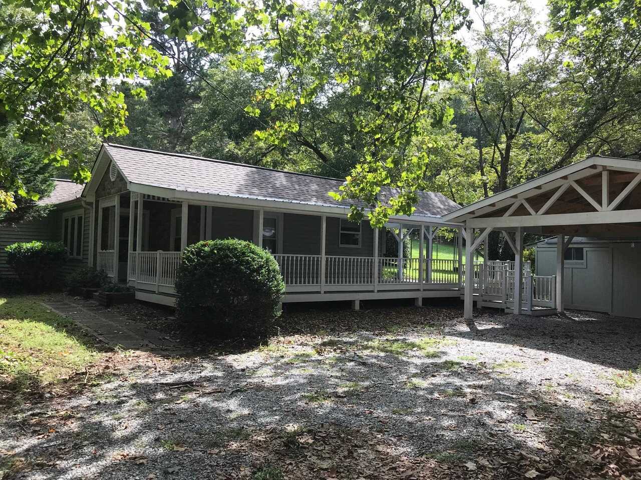 5560 Price Road Gainesville, GA 30506 - Photo 1 of 1 a front view of a house with garden