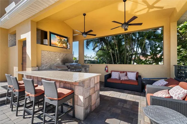 a bathroom with a granite countertop toilet sink and mirror