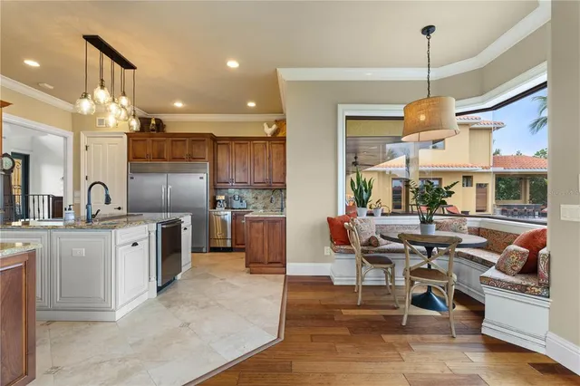 a kitchen with stainless steel appliances granite countertop a stove and a sink