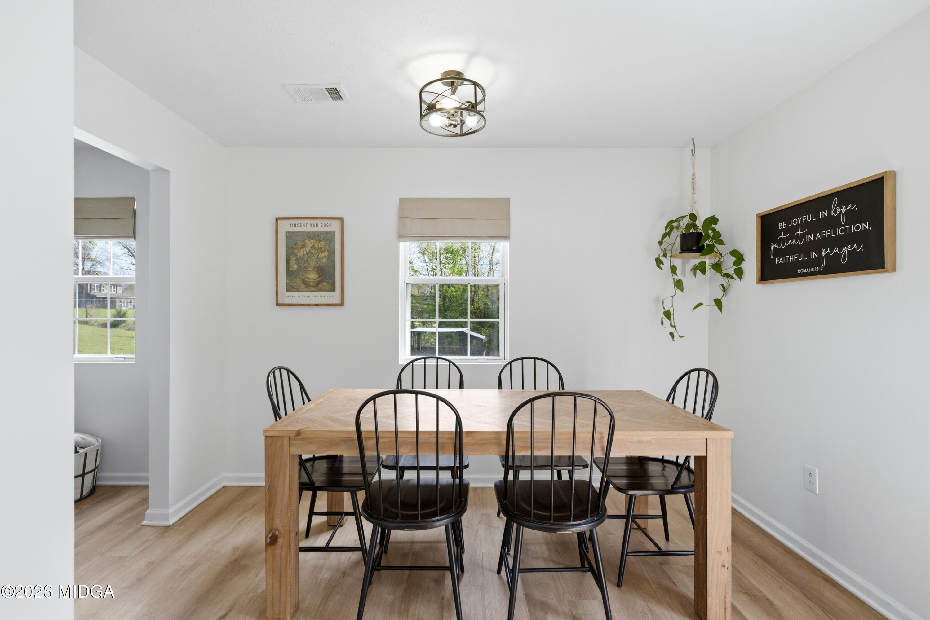 123 Mathews Road Milner, GA 30257 - Photo 15 of 51 a view of a dining room with furniture window and wooden floor