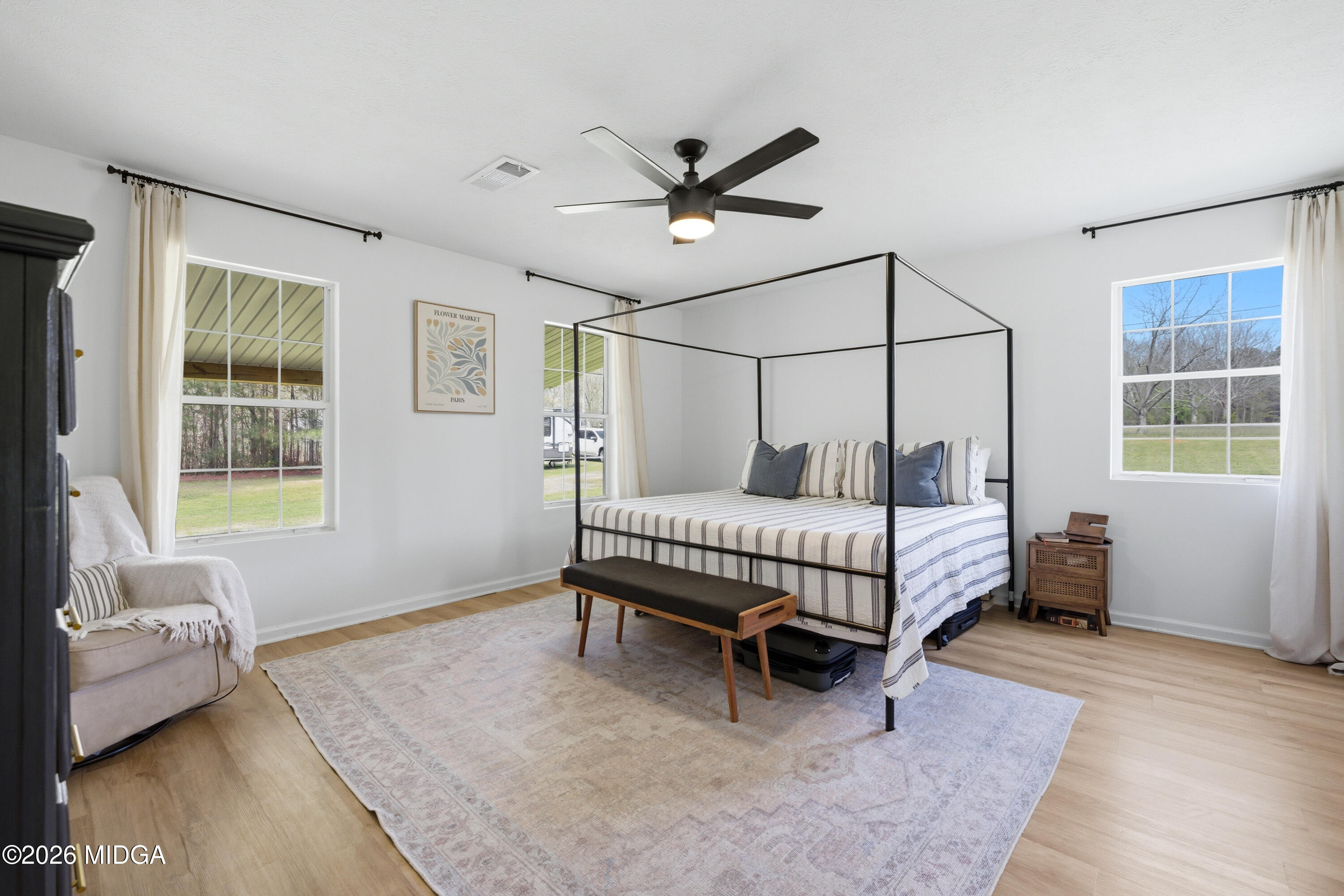 123 Mathews Road Milner, GA 30257 - Photo 16 of 51 a bedroom with a bed and a window