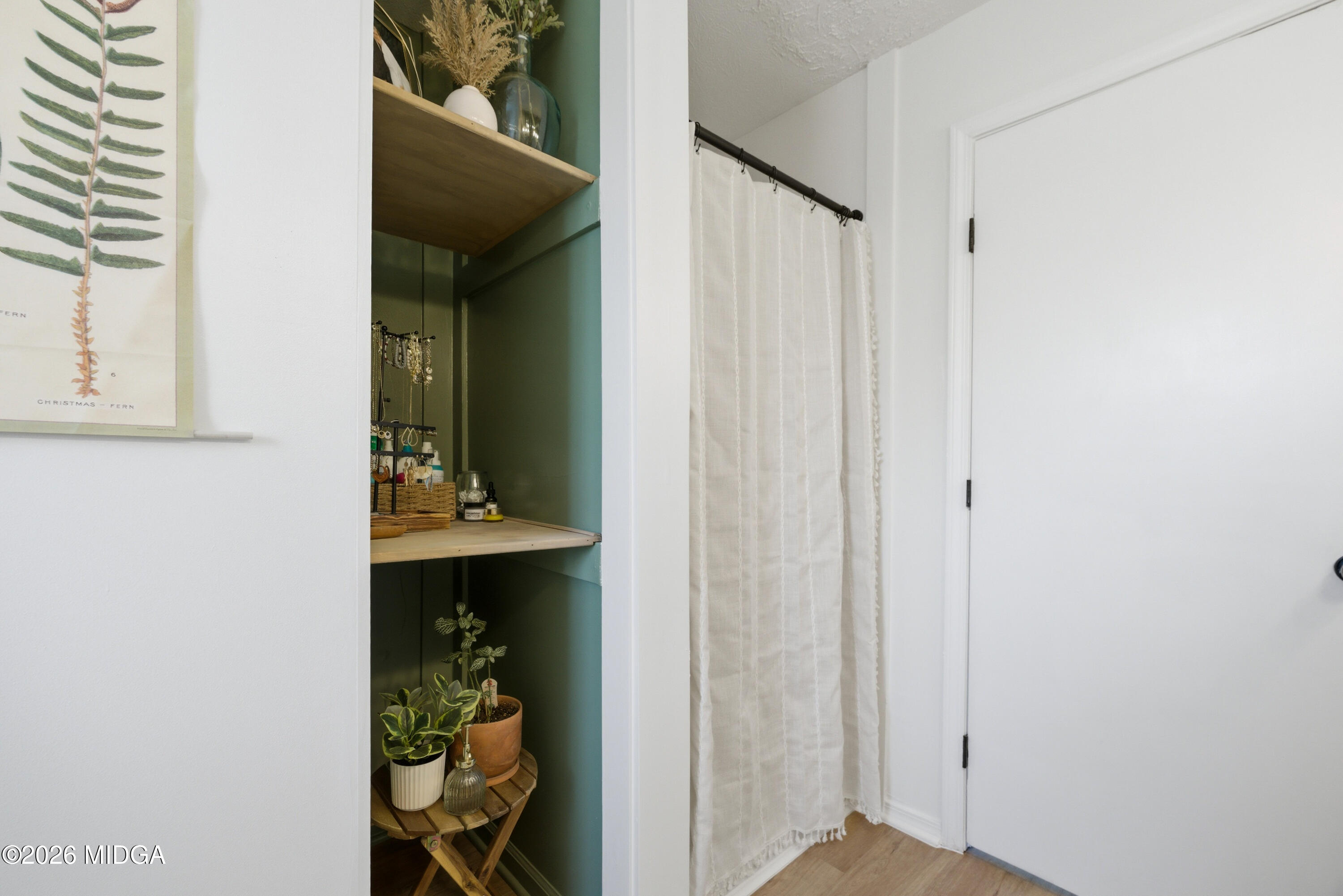 123 Mathews Road Milner, GA 30257 - Photo 20 of 51 a view of a hallway with wooden floor and closet