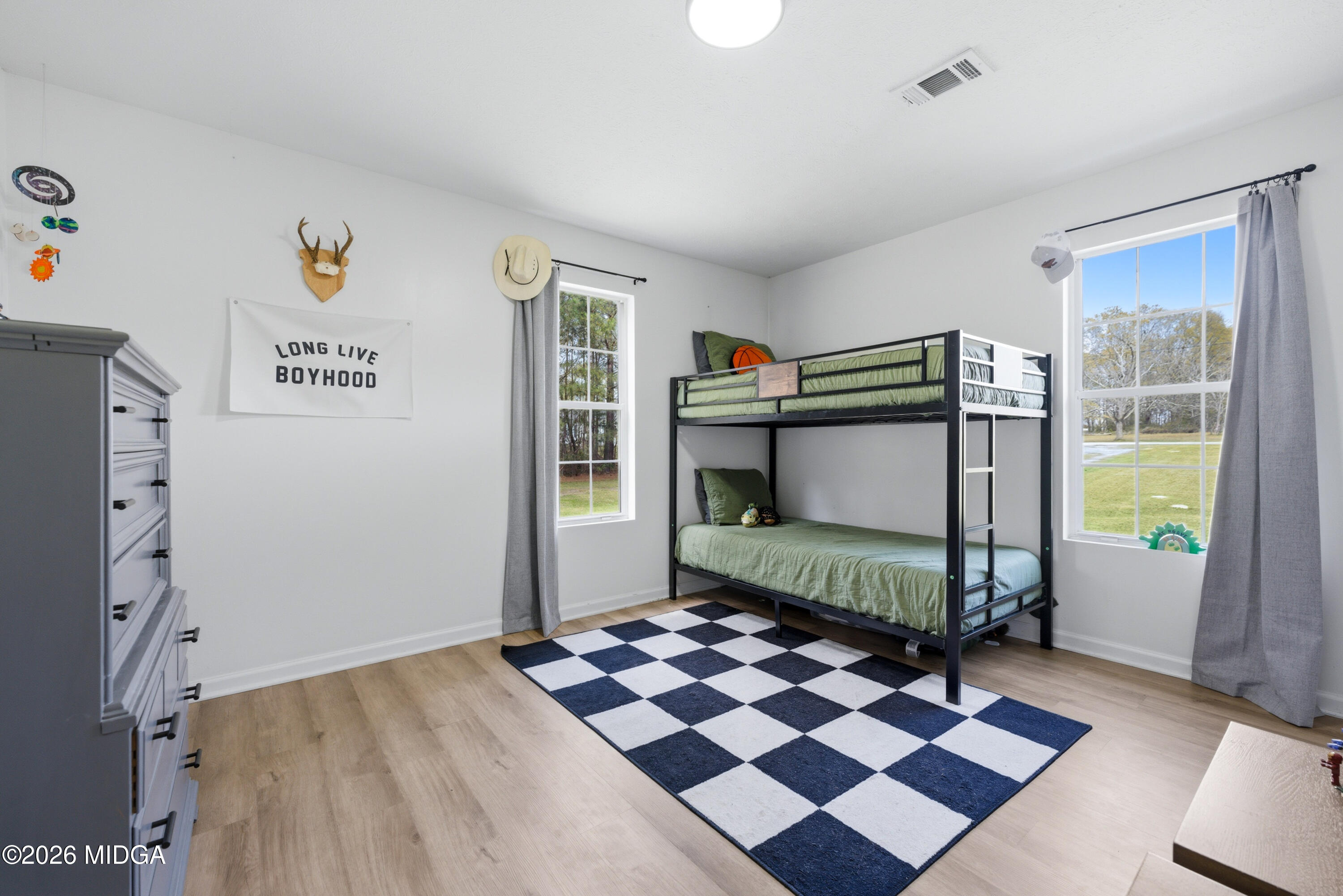 123 Mathews Road Milner, GA 30257 - Photo 22 of 51 a bedroom with a bed and a window