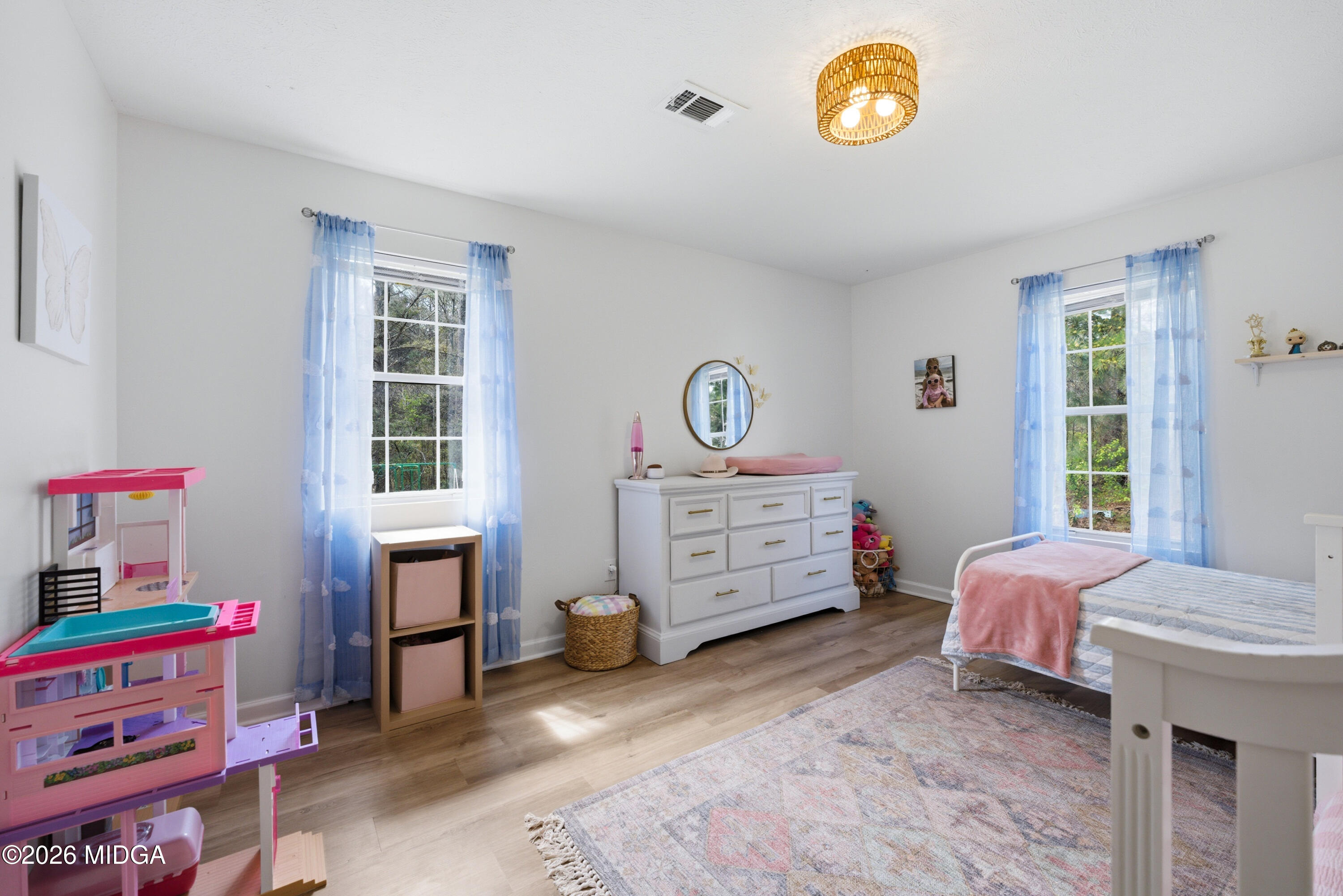 123 Mathews Road Milner, GA 30257 - Photo 25 of 51 a bedroom with a bed and a window