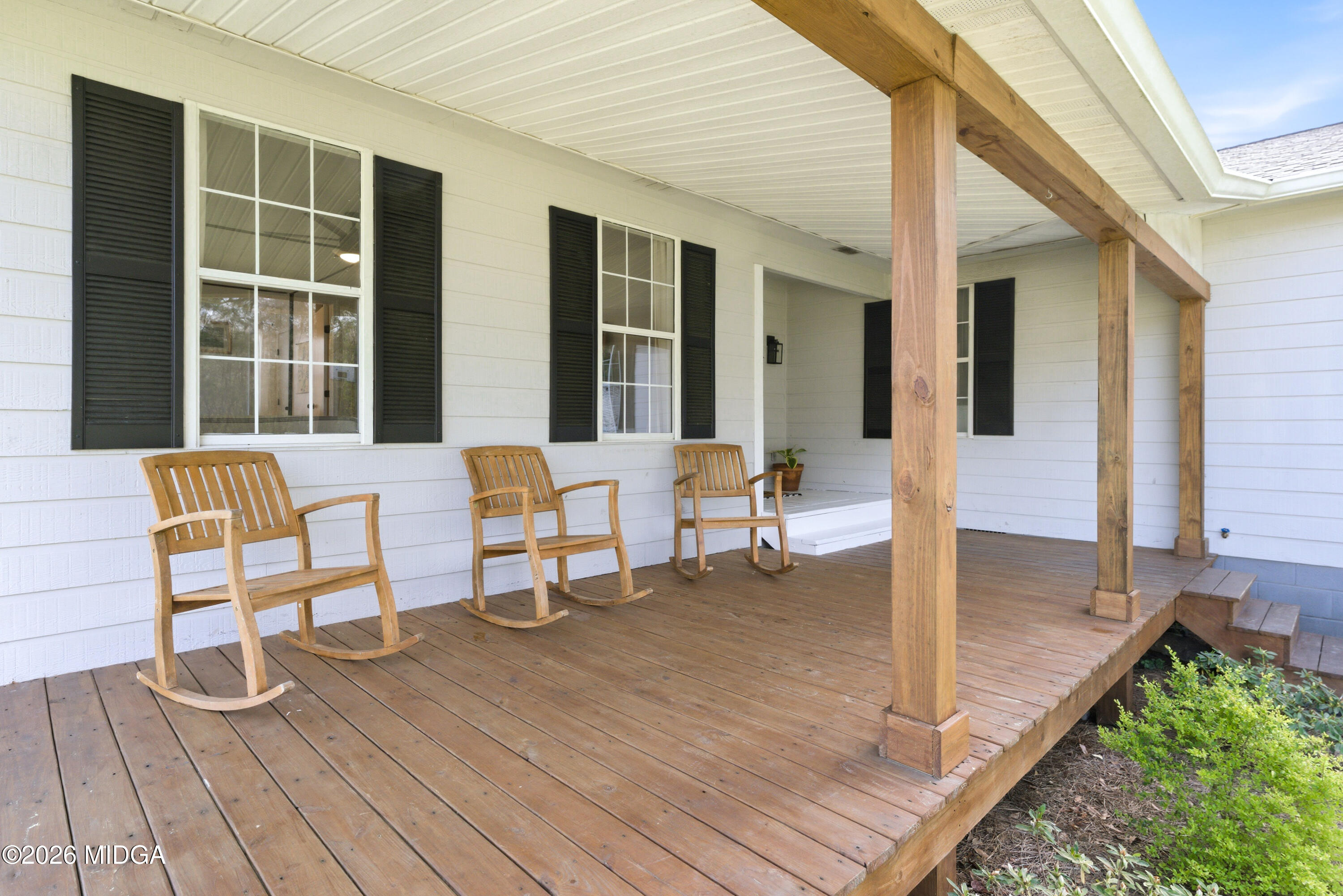 123 Mathews Road Milner, GA 30257 - Photo 3 of 51 a balcony with chairs and with wooden floor
