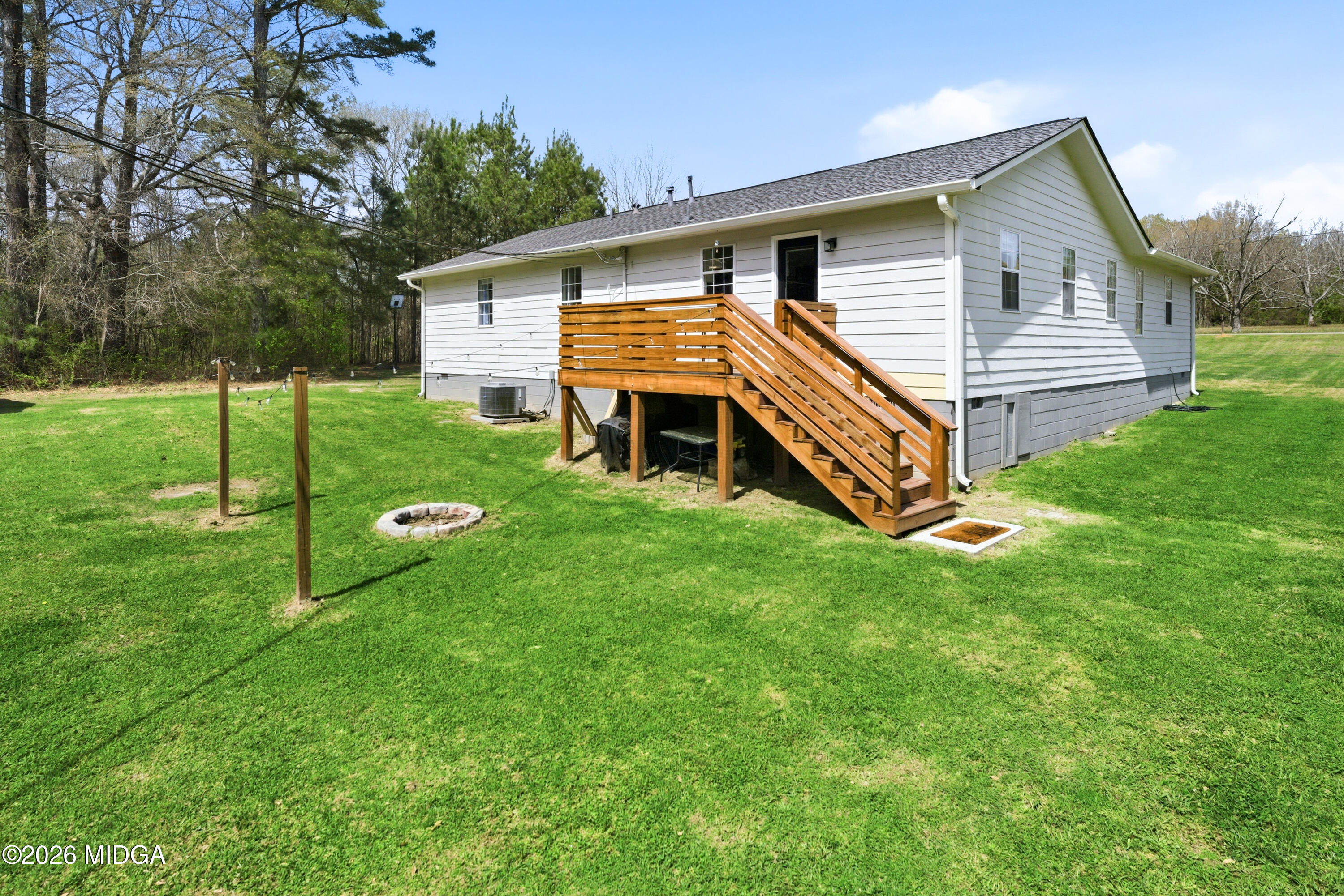 123 Mathews Road Milner, GA 30257 - Photo 35 of 51 a front view of house with yard and green space