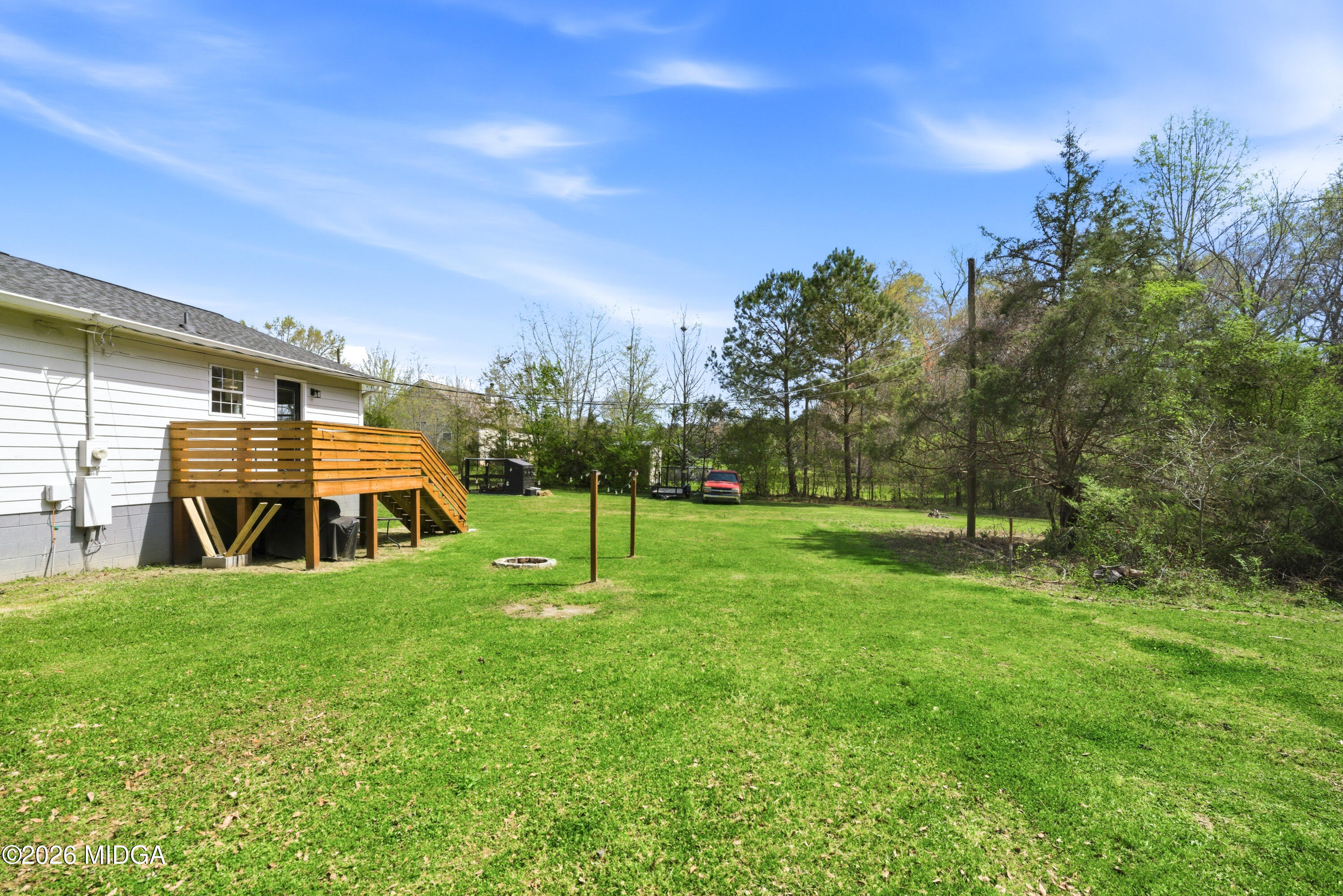 123 Mathews Road Milner, GA 30257 - Photo 37 of 51 a view of a house with a backyard