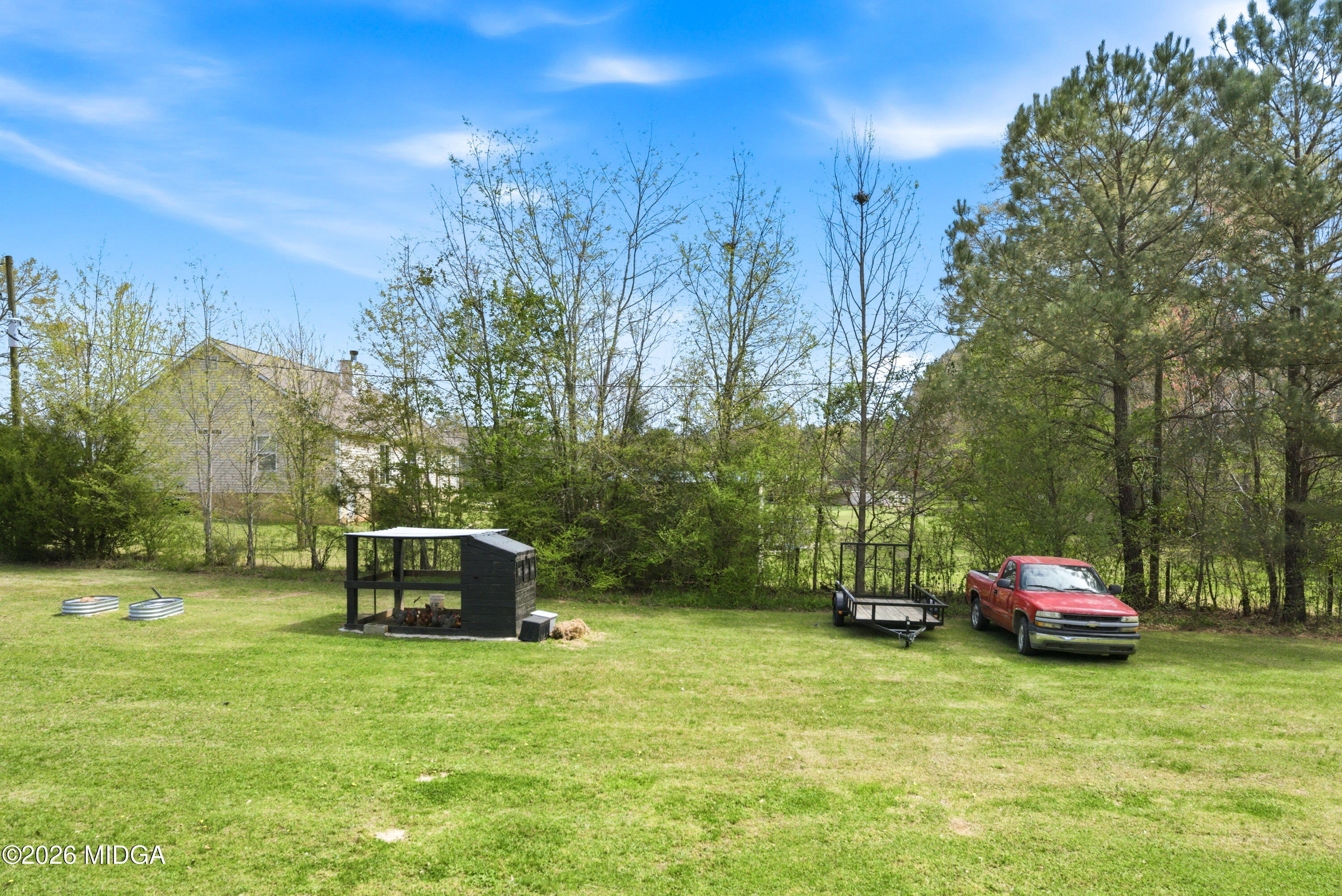 123 Mathews Road Milner, GA 30257 - Photo 38 of 51 a car parked in the middle of a field