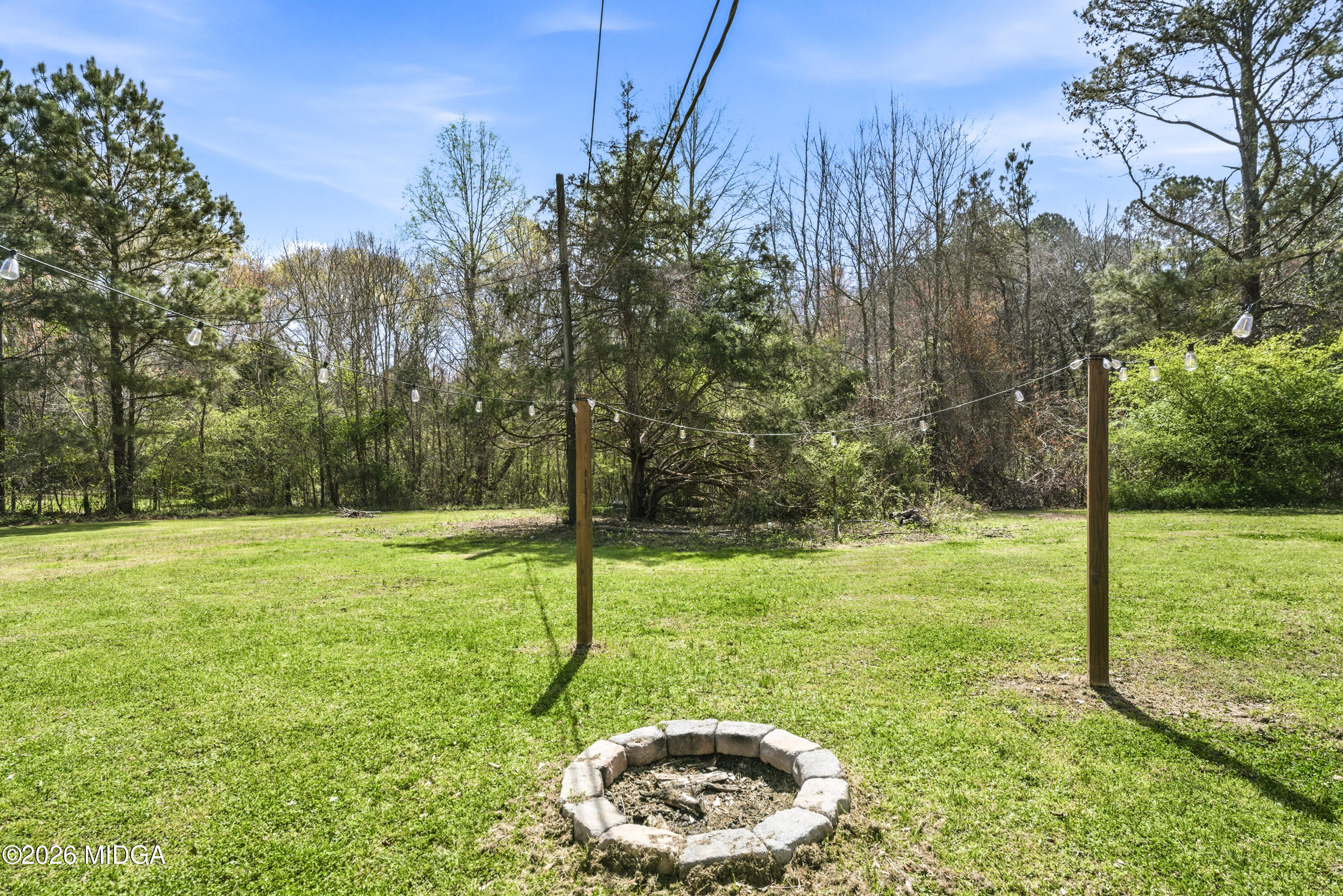 123 Mathews Road Milner, GA 30257 - Photo 40 of 51 a view of a backyard with large trees