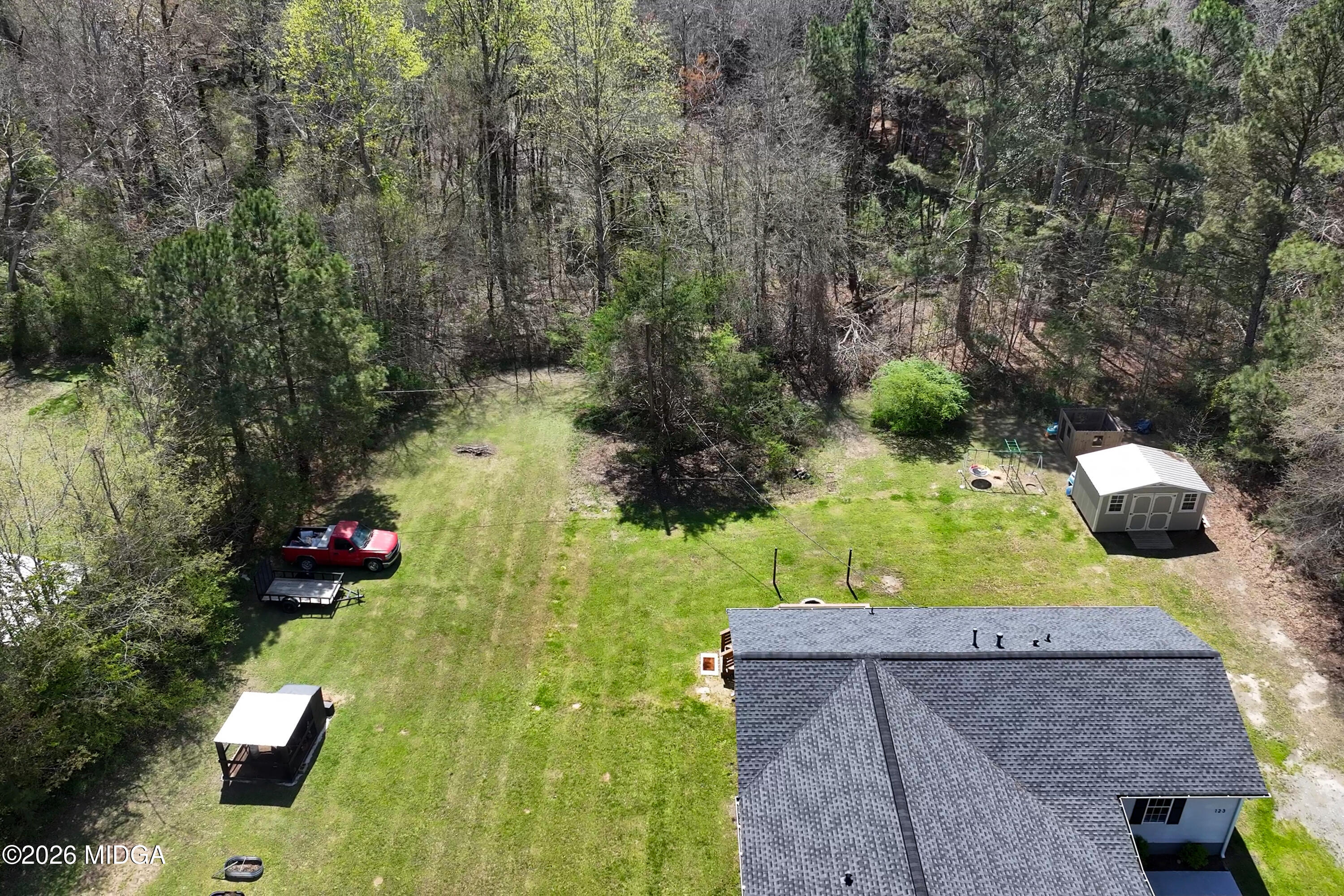 123 Mathews Road Milner, GA 30257 - Photo 46 of 51 an aerial view of a house with a yard