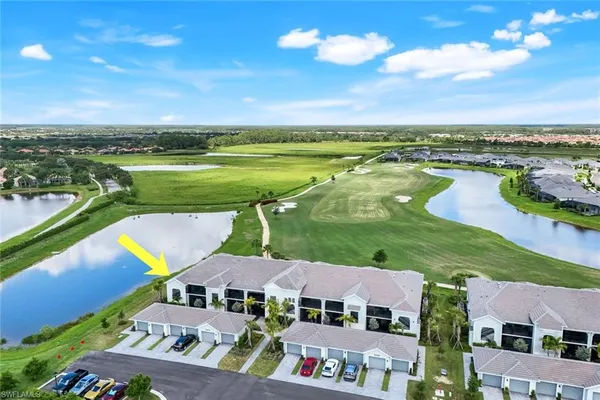 an aerial view of a house with a lake view