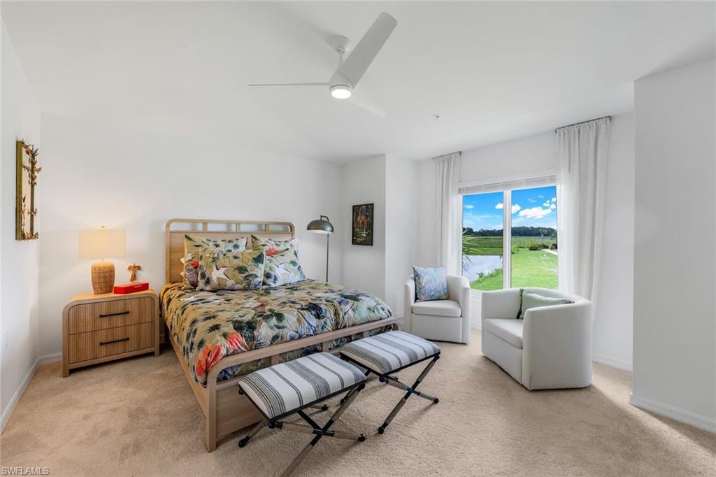 5454 Double Eagle Circle, Unit 3321 Immokalee, FL 34142 - Photo 13 of 40 a bedroom with furniture and a large window