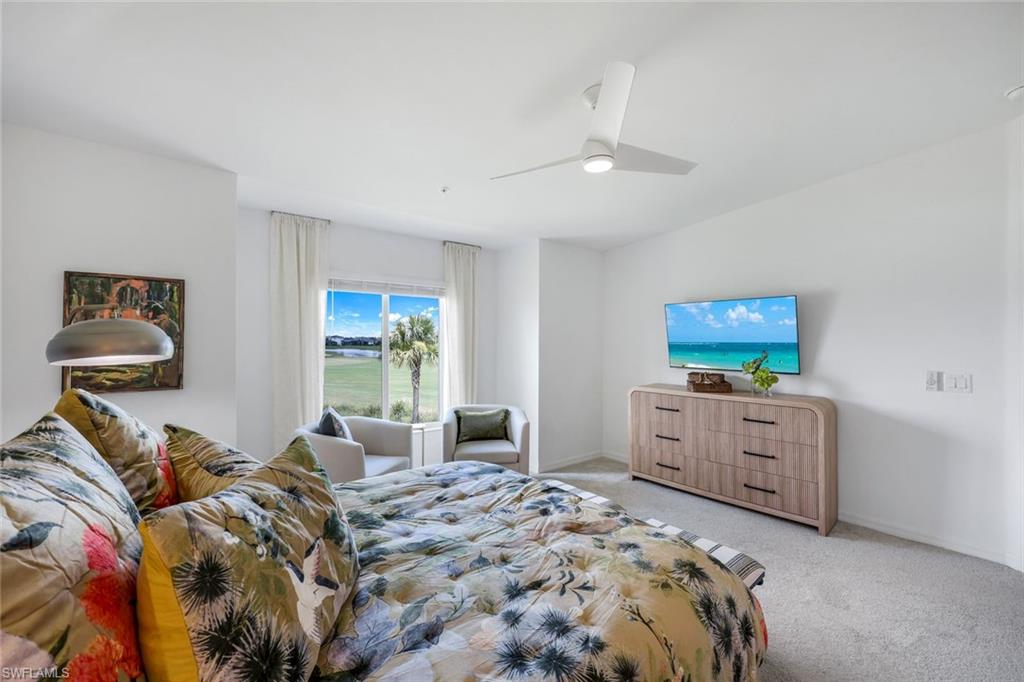 5454 Double Eagle Circle, Unit 3321 Immokalee, FL 34142 - Photo 14 of 40 a bed room with a bed and furniture