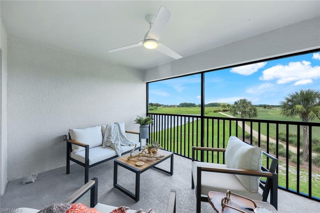 5454 Double Eagle Circle, Unit 3321 Immokalee, FL 34142 - Photo 21 of 40 a view of a chairs and table in patio