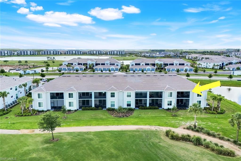 5454 Double Eagle Circle, Unit 3321 Immokalee, FL 34142 - Photo 24 of 40 a front view of a house with a garden