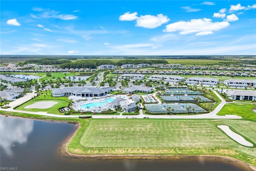 5454 Double Eagle Circle, Unit 3321 Immokalee, FL 34142 - Photo 27 of 40 a view of a swimming pool with a lake view