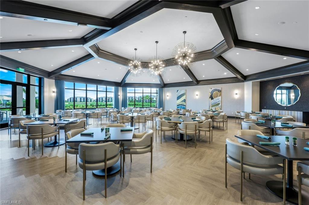 5454 Double Eagle Circle, Unit 3321 Immokalee, FL 34142 - Photo 36 of 40 a living room with lots of furniture and a large window