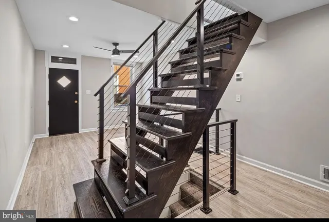 a view of entryway with wooden floor