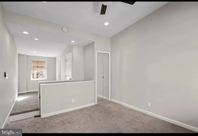 a bathroom with a bathtub and a window