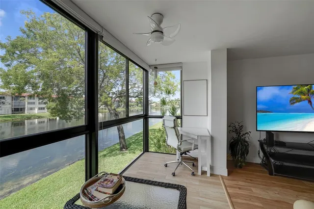 a room with furniture and a floor to ceiling window