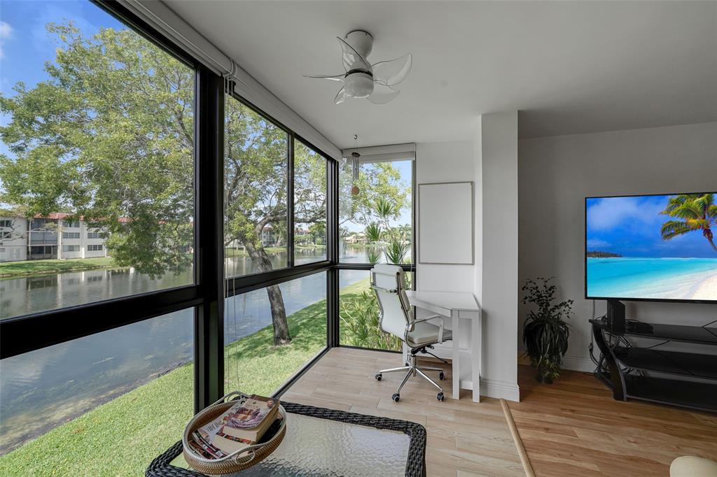 a room with furniture and a floor to ceiling window
