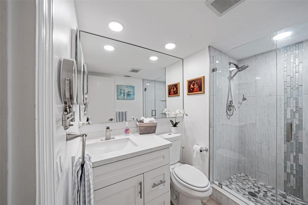 361 South Hollybrook Drive, Unit 201 Pembroke Pines, FL 33025 - Photo 11 of 52 a bathroom with a sink toilet double vanity and shower