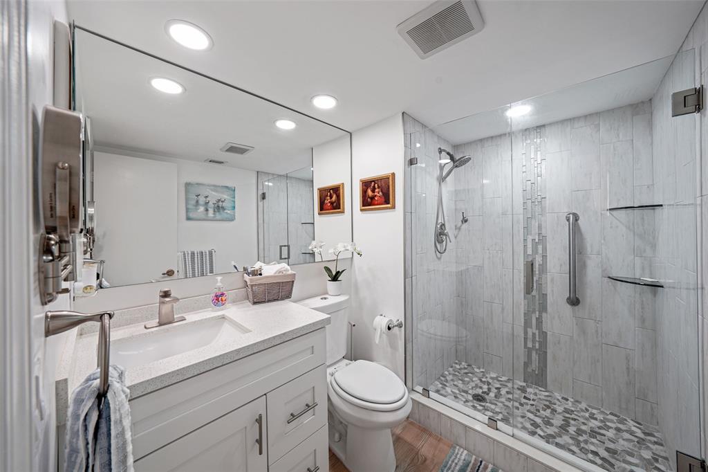 361 South Hollybrook Drive, Unit 201 Pembroke Pines, FL 33025 - Photo 12 of 52 a bathroom with a sink toilet and shower