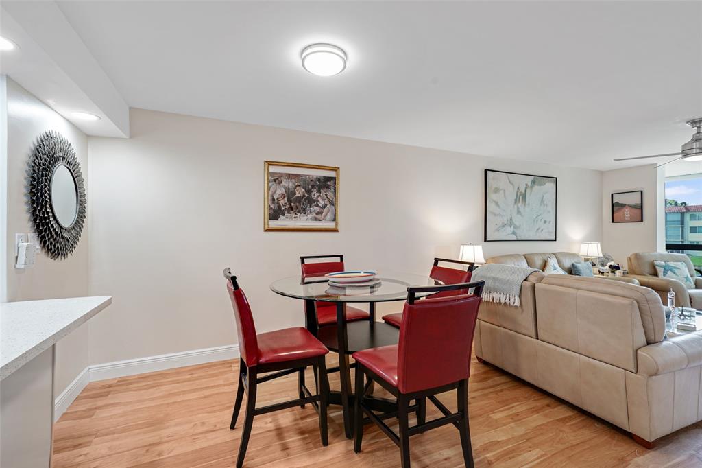 361 South Hollybrook Drive, Unit 201 Pembroke Pines, FL 33025 - Photo 16 of 52 a dining room with furniture and a mirror