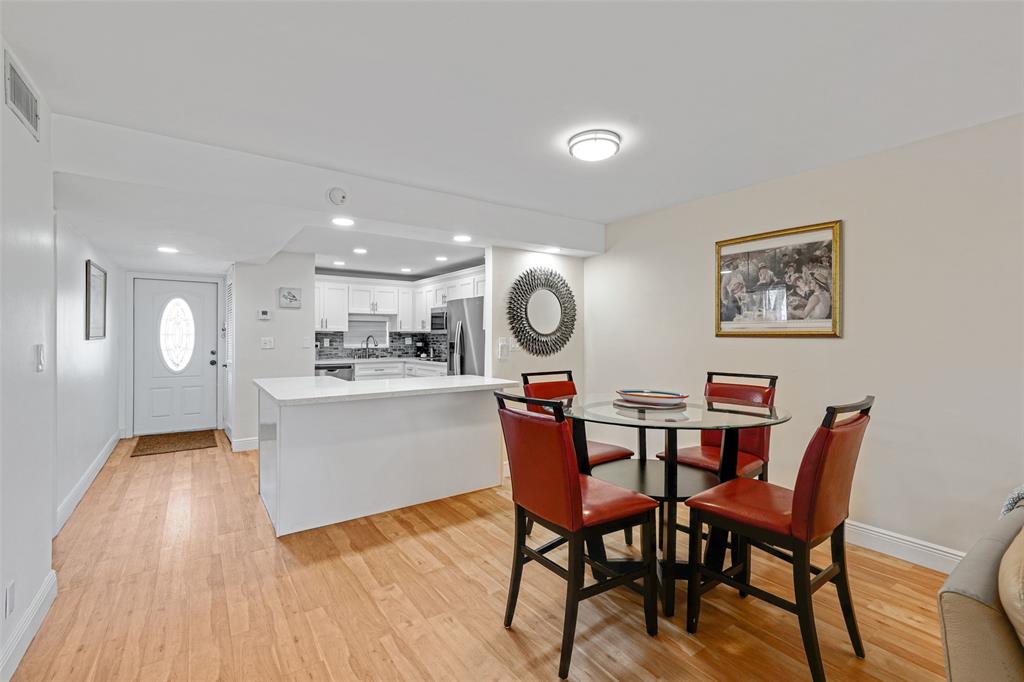 361 South Hollybrook Drive, Unit 201 Pembroke Pines, FL 33025 - Photo 17 of 52 a view of a dining room with furniture and wooden floor