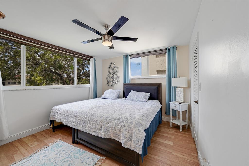 361 South Hollybrook Drive, Unit 201 Pembroke Pines, FL 33025 - Photo 24 of 52 a bedroom with a large bed and a large window