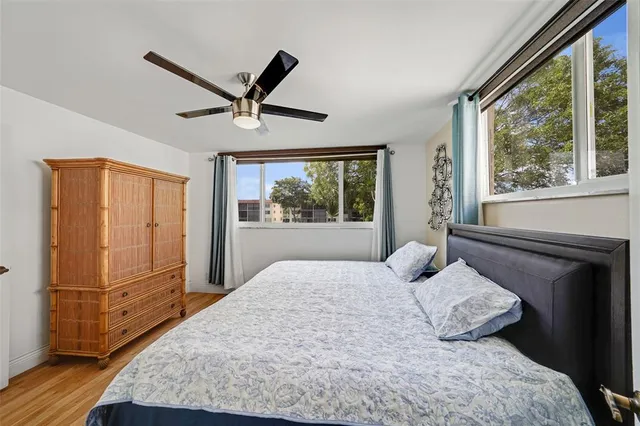 a bedroom with a large bed and a window