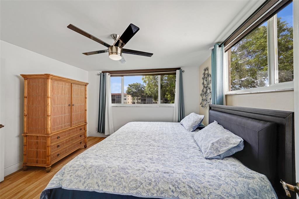 361 South Hollybrook Drive, Unit 201 Pembroke Pines, FL 33025 - Photo 25 of 52 a bedroom with a large bed and a window