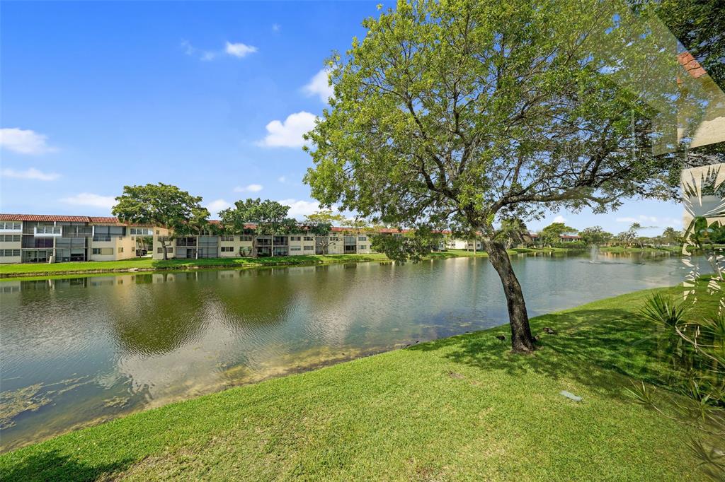 361 South Hollybrook Drive, Unit 201 Pembroke Pines, FL 33025 - Photo 28 of 52 a view of a lake from a yard