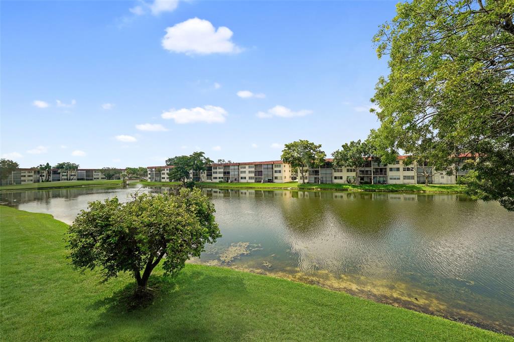 361 South Hollybrook Drive, Unit 201 Pembroke Pines, FL 33025 - Photo 29 of 52 a view of a lake with a yard