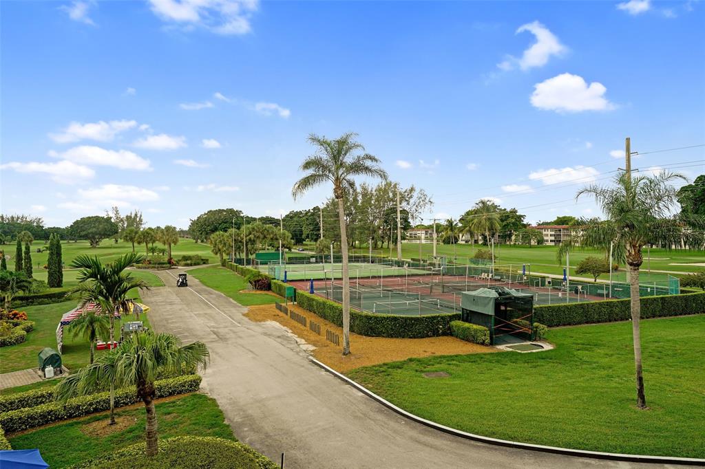 361 South Hollybrook Drive, Unit 201 Pembroke Pines, FL 33025 - Photo 3 of 52 a view of a swimming pool with a yard
