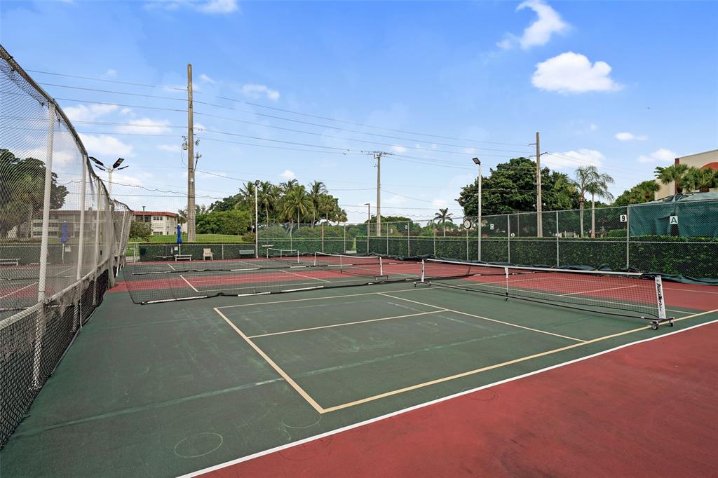 361 South Hollybrook Drive, Unit 201 Pembroke Pines, FL 33025 - Photo 41 of 52 a view of a tennis court