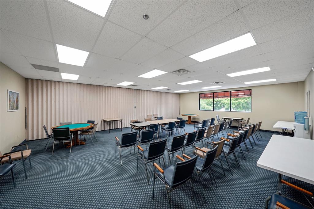 361 South Hollybrook Drive, Unit 201 Pembroke Pines, FL 33025 - Photo 47 of 52 a group of people sitting at tables in a room