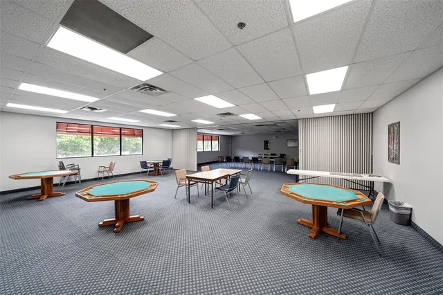 a living room with furniture a rug and a flat screen tv