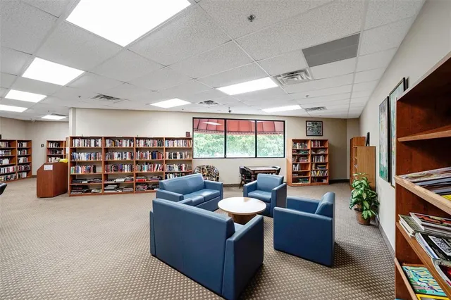 a view of a room with lots of furniture and garage