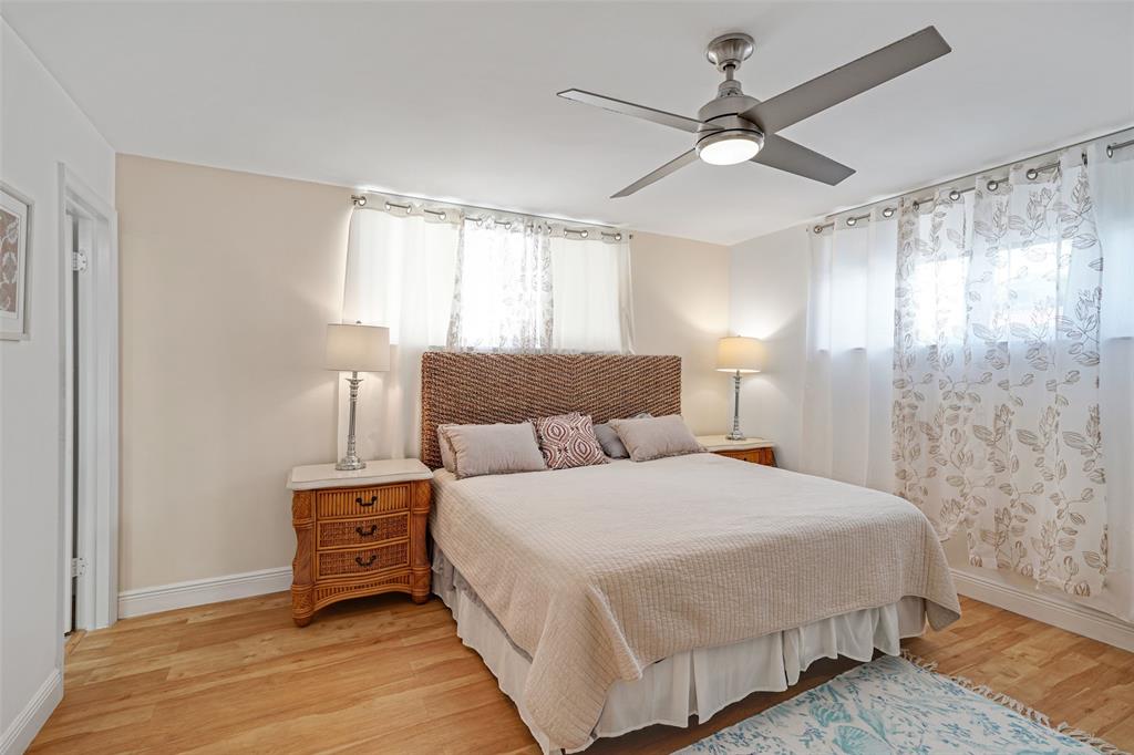 361 South Hollybrook Drive, Unit 201 Pembroke Pines, FL 33025 - Photo 9 of 52 a bedroom with a bed and a ceiling fan